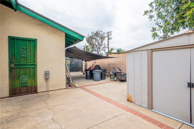 2136 Forbes Ave, Claremont, CA 91711 - view of patio / terrace featuring a storage shed, fence, and an outbuilding