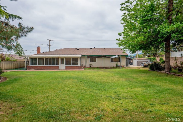 2136 Forbes Ave, Claremont, CA 91711 - back of property with fence, a sunroom, a chimney, and a yard