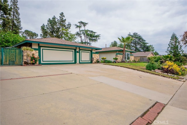 2136 Forbes Ave, Claremont, CA 91711 - view of front of property featuring driveway, stone siding, and stucco siding