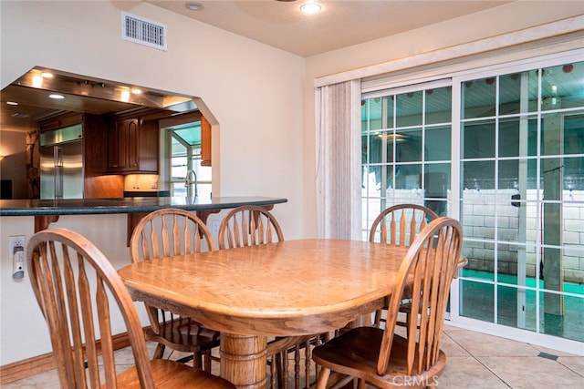2136 Forbes Ave, Claremont, CA 91711 - dining space featuring visible vents, arched walkways, and light tile patterned floors