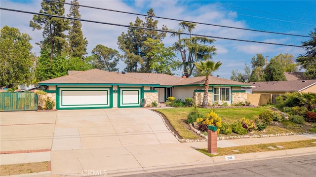 2136 Forbes Ave, Claremont, CA 91711 - single story home featuring driveway, a front yard, fence, an attached garage, and stone siding