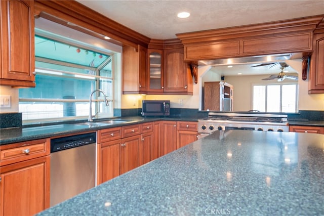 2136 Forbes Ave, Claremont, CA 91711 - kitchen with brown cabinetry, stove, ceiling fan, a sink, and dishwasher