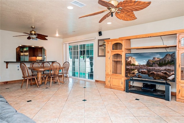 2136 Forbes Ave, Claremont, CA 91711 - living area with visible vents, a ceiling fan, baseboards, and light tile patterned flooring