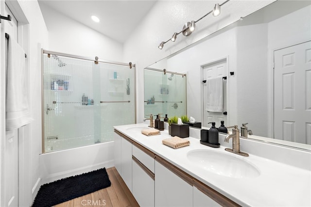 112 Cinnamon Teal, Aliso Viejo, CA 92656 - full bath featuring wood finished floors, double vanity, bath / shower combo with glass door, lofted ceiling, and recessed lighting