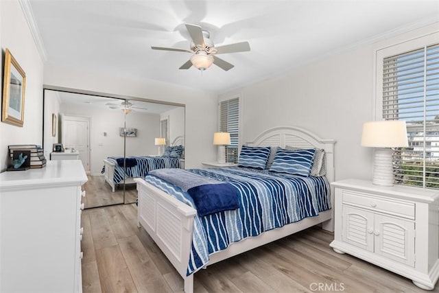24242 Santa Clara Ave Unit 26, Dana Point, CA 92629 - bedroom with a closet, ornamental molding, a ceiling fan, and light wood finished floors