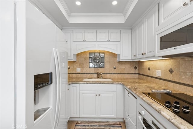 24242 Santa Clara Ave Unit 26, Dana Point, CA 92629 - kitchen with white appliances, white cabinetry, a sink, and a raised ceiling