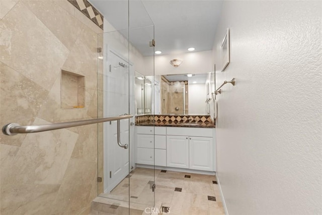 24242 Santa Clara Ave Unit 26, Dana Point, CA 92629 - full bathroom with vanity, recessed lighting, a stall shower, and tasteful backsplash