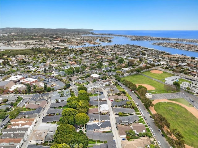 drone / aerial view with a residential view and a water view