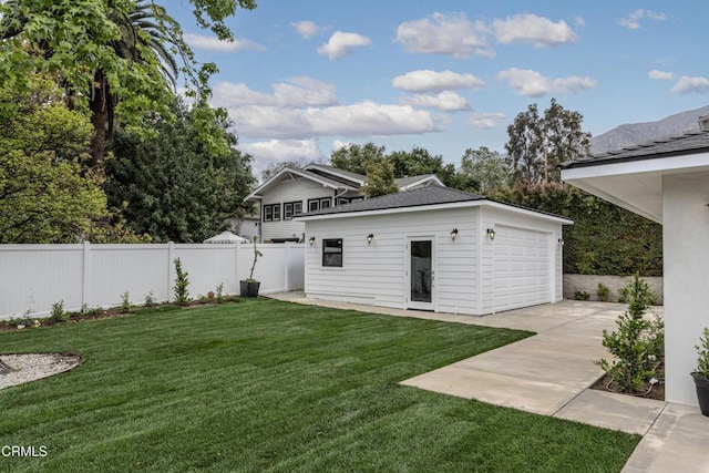 313 N Sunnyside Ave, Sierra Madre, CA 91024 - rear view of property featuring fence, an outbuilding, concrete driveway, a patio, and a yard