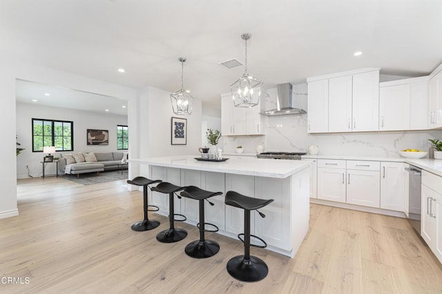 313 N Sunnyside Ave, Sierra Madre, CA 91024 - kitchen featuring wall chimney range hood, a center island, light wood finished floors, and recessed lighting