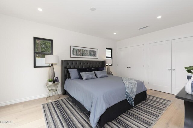 313 N Sunnyside Ave, Sierra Madre, CA 91024 - bedroom with multiple closets, recessed lighting, light wood-style flooring, and visible vents