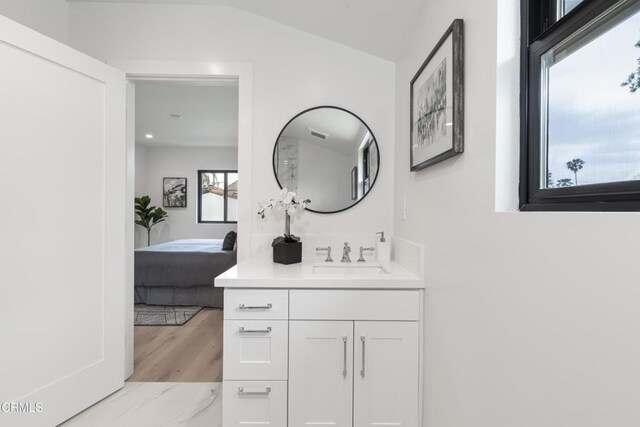 313 N Sunnyside Ave, Sierra Madre, CA 91024 - bathroom featuring vanity, ensuite bath, lofted ceiling, and wood finished floors