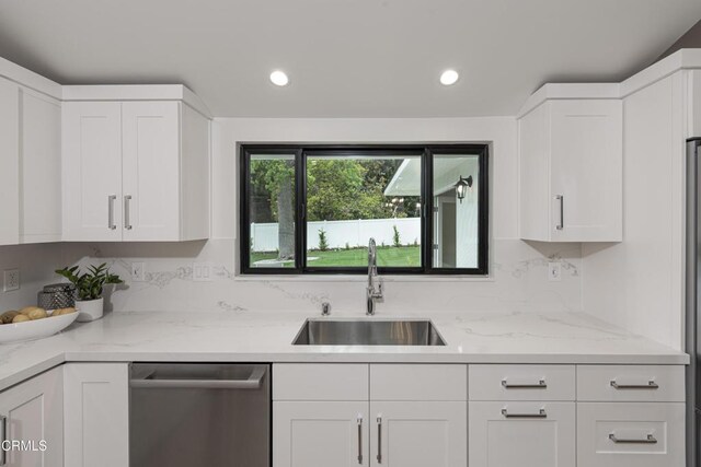 313 N Sunnyside Ave, Sierra Madre, CA 91024 - kitchen with stainless steel dishwasher, white cabinets, light stone countertops, and a sink