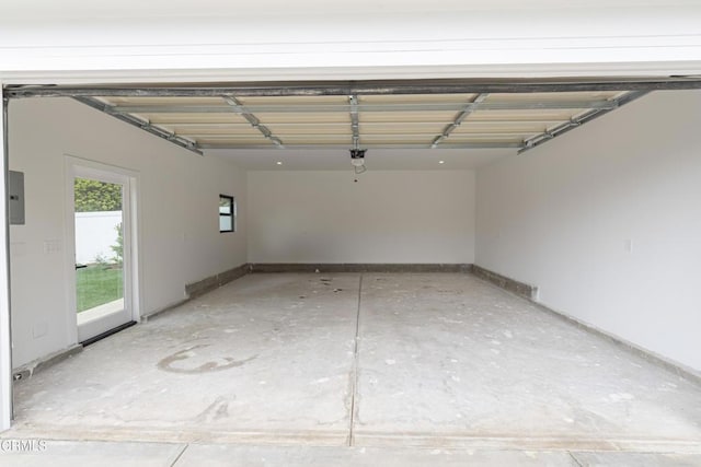 313 N Sunnyside Ave, Sierra Madre, CA 91024 - garage with baseboards and a garage door opener
