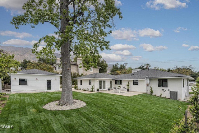 313 N Sunnyside Ave, Sierra Madre, CA 91024 - back of house with a lawn, a patio, central AC, and a mountain view