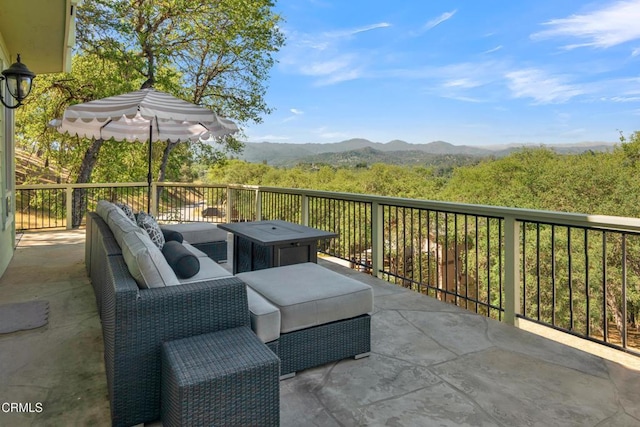 view of patio with a mountain view and an outdoor hangout area