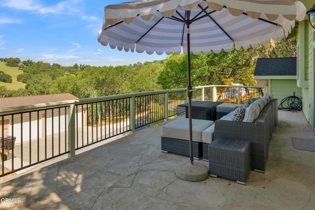 view of patio featuring an outdoor hangout area and a wooded view