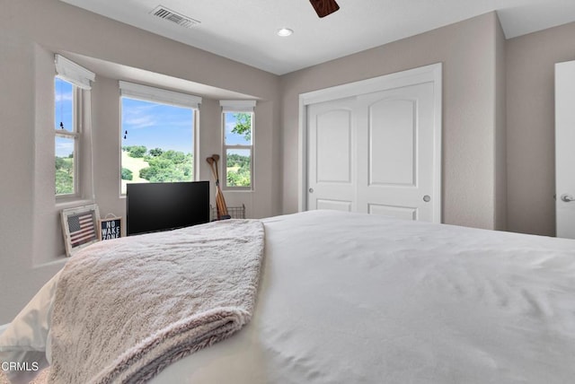 bedroom featuring a ceiling fan, a closet, recessed lighting, and visible vents