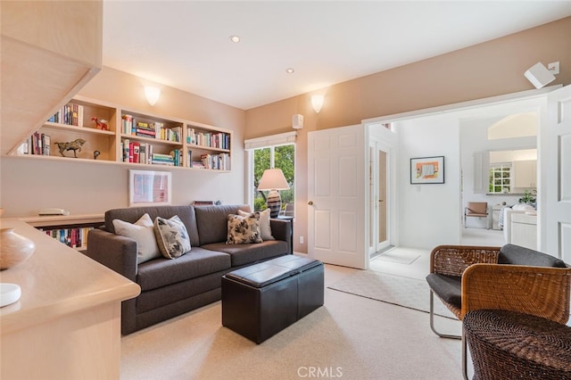 living room featuring recessed lighting and light carpet