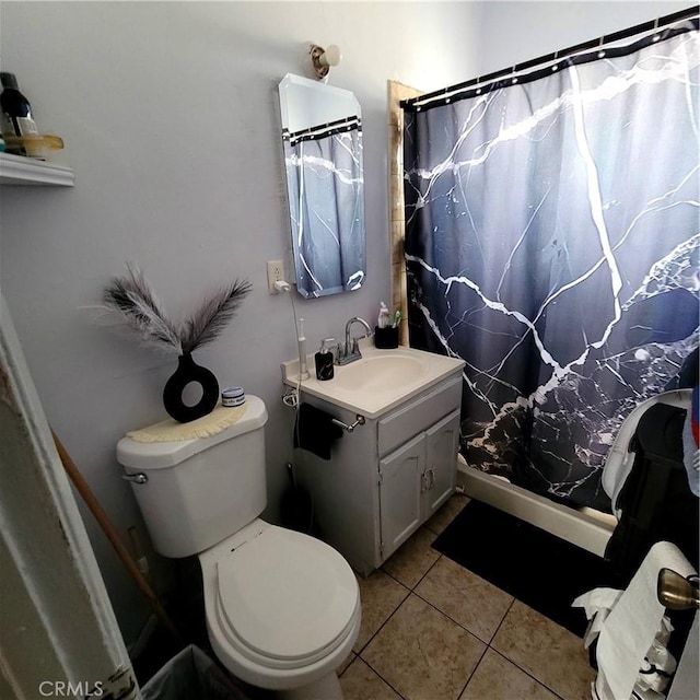 full bathroom featuring toilet, a shower with shower curtain, tile patterned flooring, and vanity