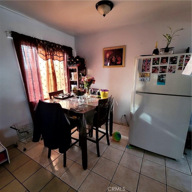 dining area featuring light tile patterned floors