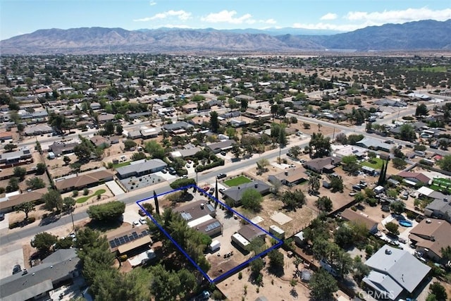 7486 Earhart Ave, Hesperia, CA 92345 - aerial perspective of suburban area featuring a mountainous background and property parcel outlined