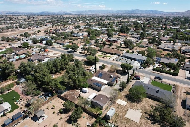 7486 Earhart Ave, Hesperia, CA 92345 - aerial overview of property's location featuring a mountainous background and nearby suburban area