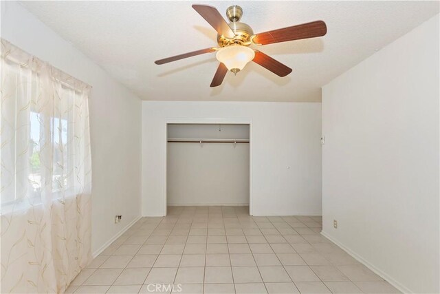 7486 Earhart Ave, Hesperia, CA 92345 - unfurnished bedroom with a closet and ceiling fan