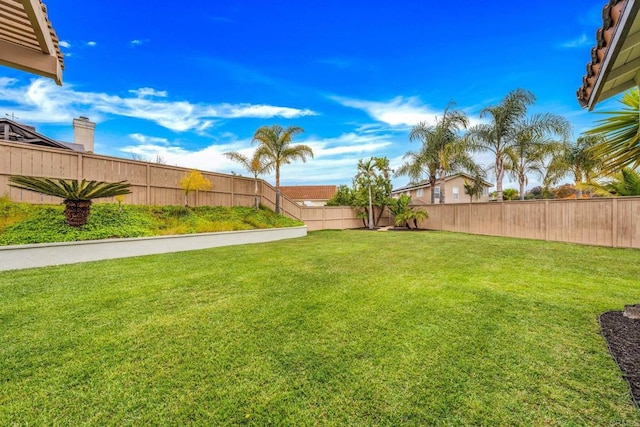 view of yard with a fenced backyard
