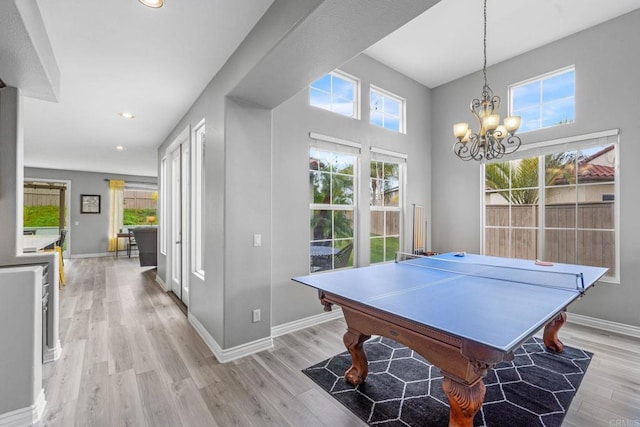 game room featuring pool table, baseboards, a chandelier, recessed lighting, and light wood-style flooring