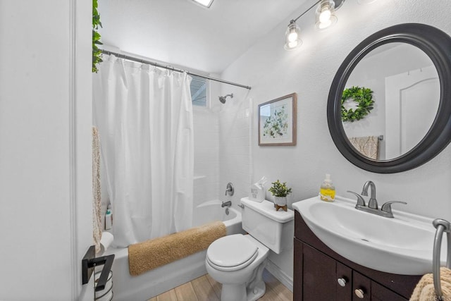 bathroom with wood finished floors, vanity, baseboards, toilet, and shower / bathtub combination with curtain