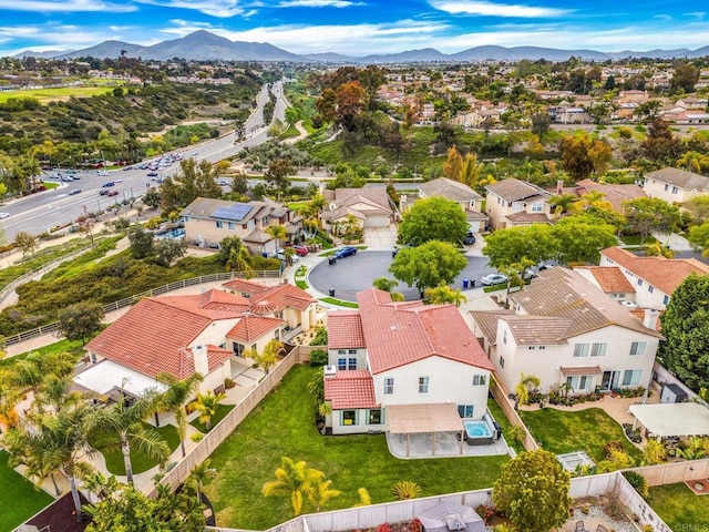 drone / aerial view with a mountain view and a residential view