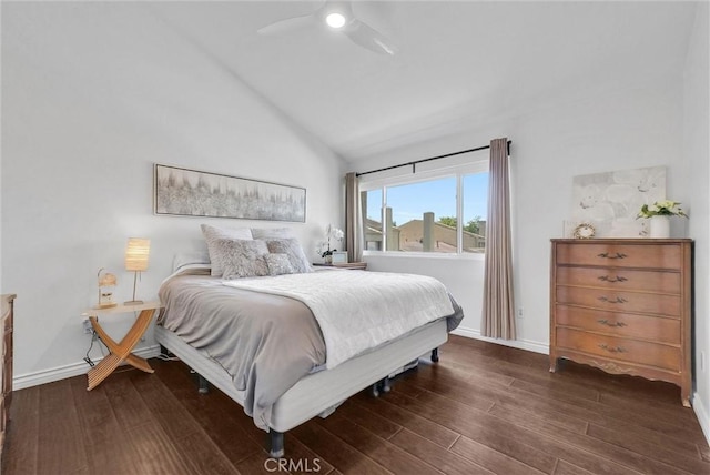 bedroom featuring baseboards, ceiling fan, vaulted ceiling, and wood finished floors