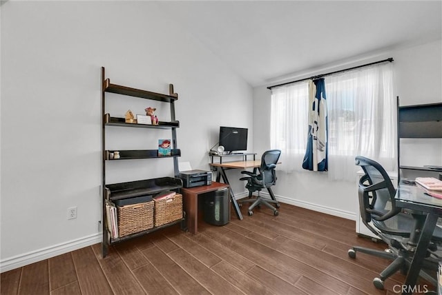 office space with baseboards, wood finished floors, and lofted ceiling