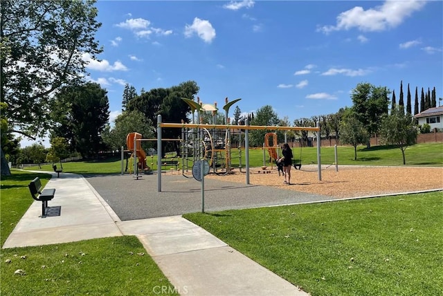 communal playground featuring a lawn