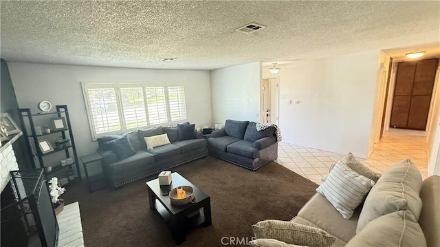 carpeted living room featuring a textured ceiling and visible vents