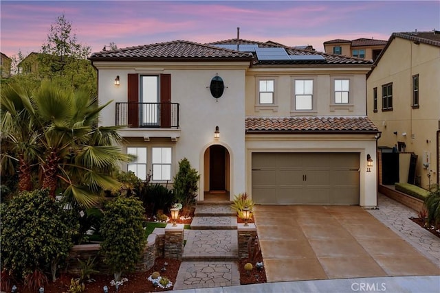 11 Cielo Arroyo, Mission Viejo, CA 92692 - view of front of home featuring a balcony, a tiled roof, solar panels, and stucco siding