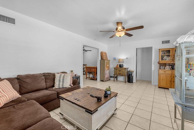 living area with visible vents, ceiling fan, and light tile patterned flooring