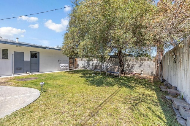 view of yard with a fenced backyard