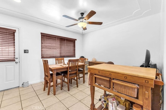 dining area with a ceiling fan, baseboards, and light tile patterned flooring