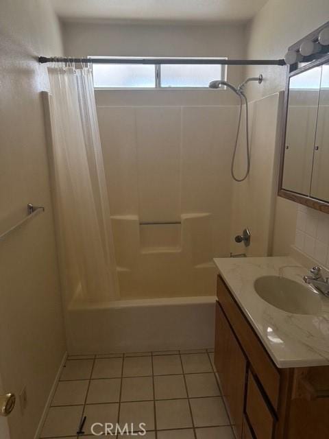 full bath featuring tile patterned flooring, plenty of natural light, shower / bath combination with curtain, and vanity