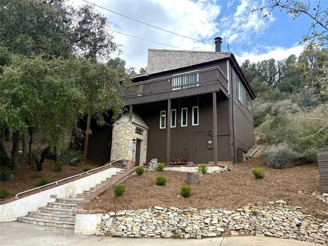 1909 Pioneer Way, Pine Mountain Club, CA 93222 - view of front of home with stairs and a wooden deck