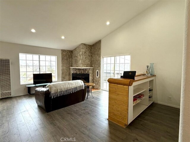 1909 Pioneer Way, Pine Mountain Club, CA 93222 - living area with a heating unit, plenty of natural light, dark wood finished floors, a stone fireplace, and recessed lighting