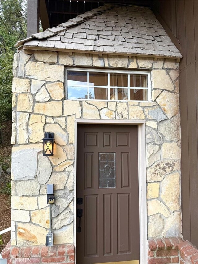 1909 Pioneer Way, Pine Mountain Club, CA 93222 - view of exterior entry featuring stone siding