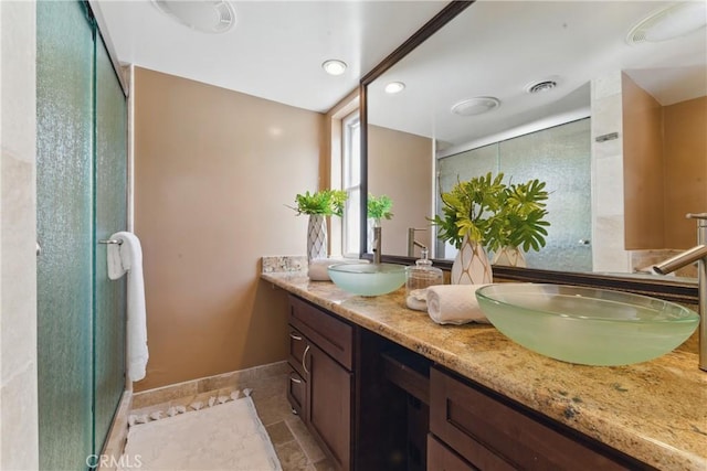 1200 E Ocean Blvd Unit 59, Long Beach, CA 90802 - bathroom with double vanity, a shower stall, baseboards, and recessed lighting