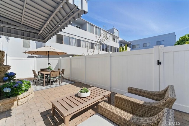 1200 E Ocean Blvd Unit 59, Long Beach, CA 90802 - fenced backyard with a patio, outdoor dining area, and a gate