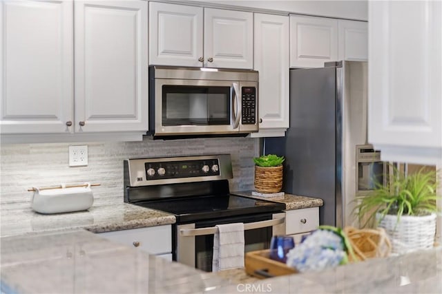 1200 E Ocean Blvd Unit 59, Long Beach, CA 90802 - kitchen with appliances with stainless steel finishes, white cabinetry, and tasteful backsplash