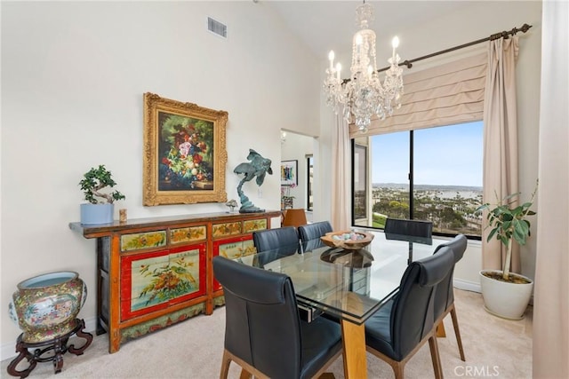 210 Lille Ln Unit 313, Newport Beach, CA 92663 - dining space featuring light colored carpet, high vaulted ceiling, visible vents, and a notable chandelier