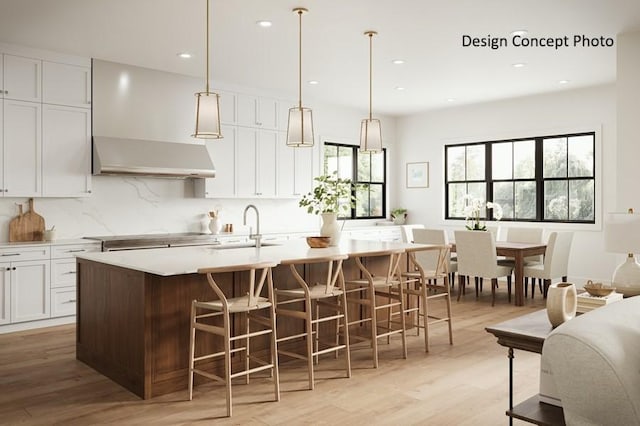 1736 Port Sheffield Pl, Newport Beach, CA 92660 - kitchen with a sink, light wood-style floors, an island with sink, wall chimney exhaust hood, and cooktop