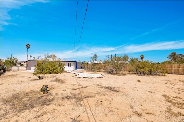 rear view of house with fence